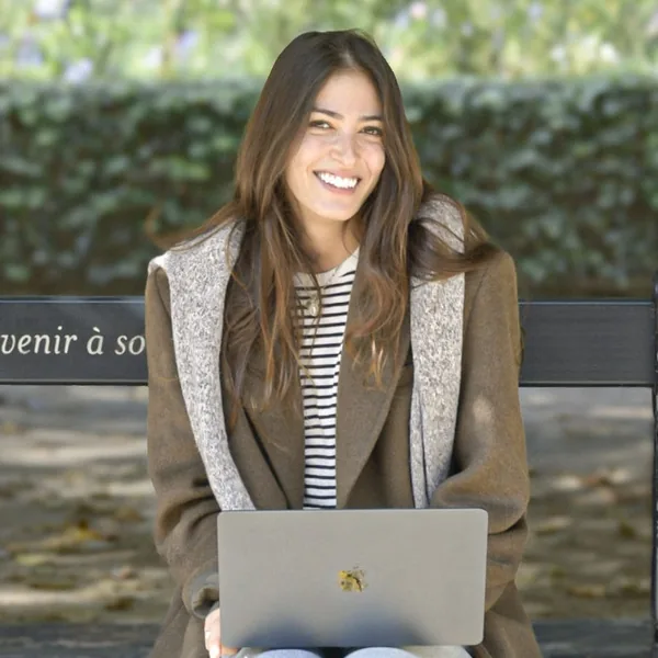 Jane, co-founder of Second Shooter Digital, with her laptop